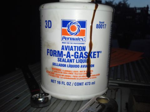 1991 Ford F-250 - A bottle of Permatex Aviation Form-A-Gasket sealant is shown, with a drip of the liquid running down the side.