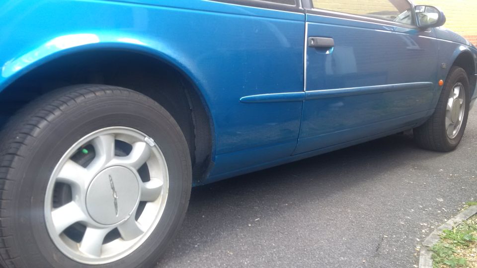 Blue 1994 Ford Thunderbird coupe side view