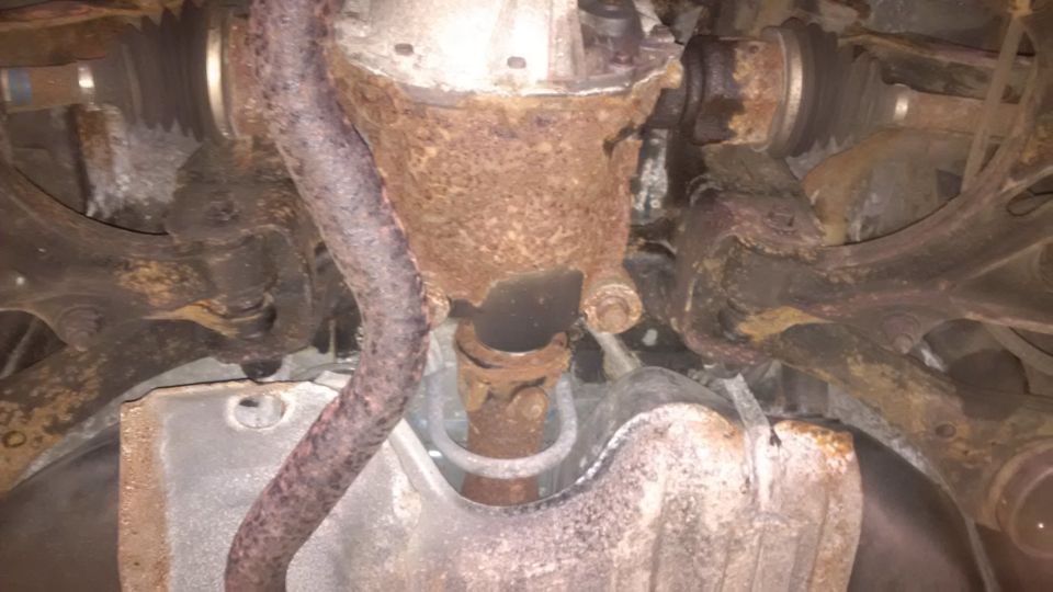 rusted driveshaft, differential housing, and suspension parts