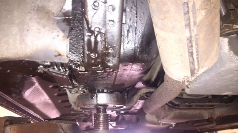 1994 Ford Thunderbird - Undercarriage view showing rust repair and undersealing work on a 1994 Ford Thunderbird.