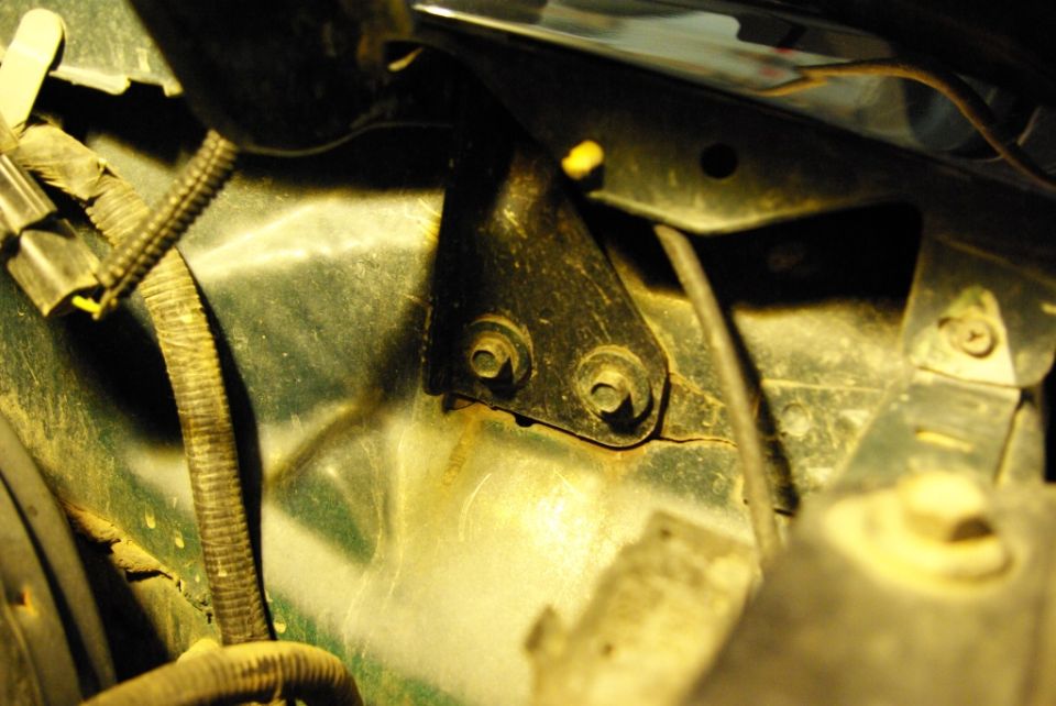 Green hood hinge bracket with two bolts