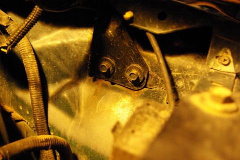 1995 Ford Bronco - Engine bay bracket and wiring harness detail, likely from a vehicle's hood area.