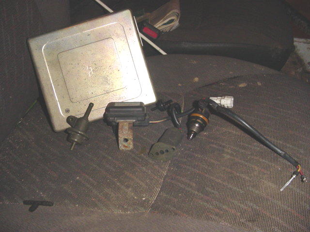Engine control unit, fuel injector, and other engine parts on a seat