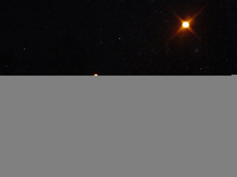 1993 Ford Taurus - A view of the night sky reveals a brilliant celestial object shining brightly amidst a field of stars.