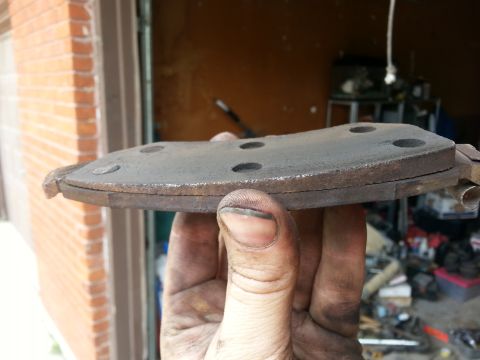 1981 Ford Bronco - This brake pad shows significant wear and is ready for replacement.
