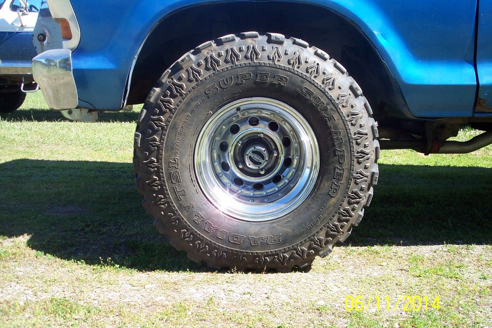 Close-up of a large off-road tire on a blue vehicle