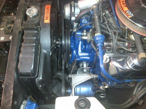 1968 Mercury Cougar - Close-up view of a vehicle's engine bay, highlighting various components and a prominent air filter.