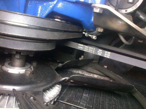 1968 Mercury Cougar - Close-up view of engine belts and fan assembly, with a blue painted component visible.
