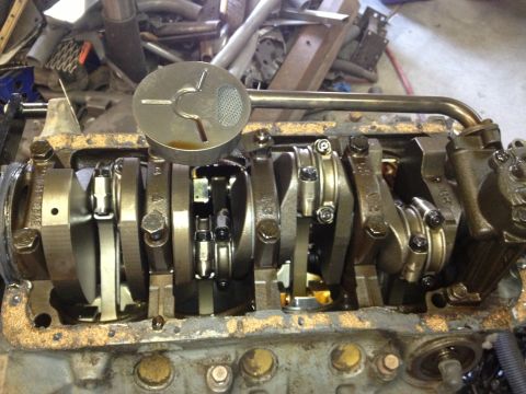 1961 International Scout 800 - Close-up view of an engine's internal components, including the crankshaft and oil pickup.