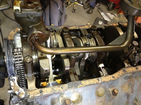 1961 International Scout 800 - Close-up view of an engine's internal components, including the crankshaft, connecting rods, and oil pump.