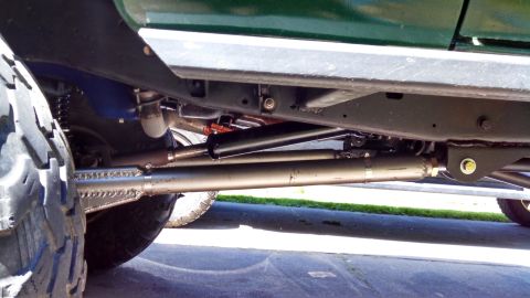 1967 Ford F-250 - Undercarriage view of a modified truck, highlighting suspension and frame modifications.