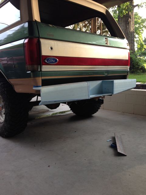 1989 Ford Bronco - Rear view of a 1989 Ford Bronco, its distinctive tri-color stripe and a custom winch bumper.
