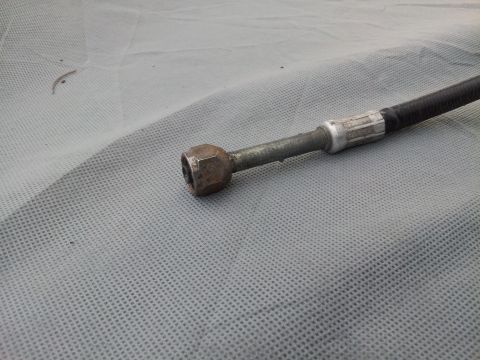 1976 Ford Ranchero - This image shows a close-up of a vehicle's air conditioning hose with a metal fitting attached.