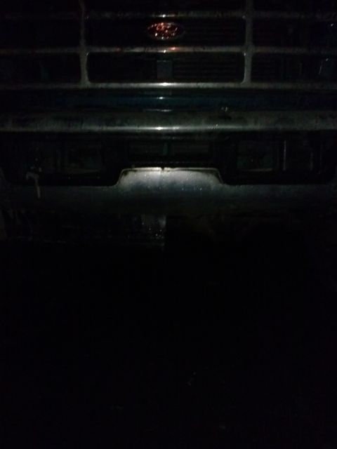 1996 Ford Bronco - Front grille of a 1990s Ford truck, identified by its grille design and emblem.