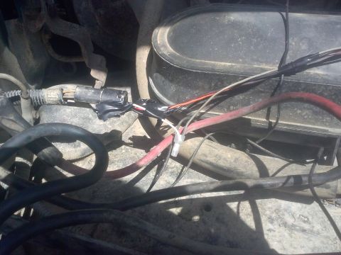 1996 Ford Bronco - This image shows a section of engine wiring, including some repairs made with black electrical tape.