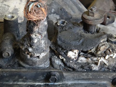 1993 Ford Taurus - This severely corroded electrical component shows significant wear and damage to its wiring and housing.