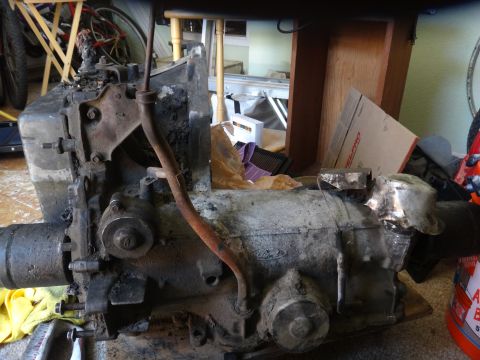 1993 Ford Taurus - A dirty transmission with a Ford logo is visible, likely removed from a vehicle.