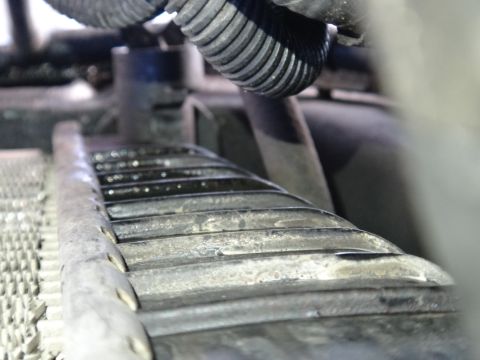 1993 Ford Taurus - Radiator fins and hoses are visible in this close-up shot.