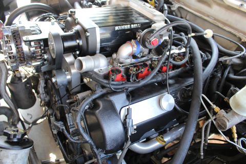 2003 Ford Crown Victoria - Kenne Bell supercharger mounted on an engine, with chrome alternator, red ignition coils and braided lines.