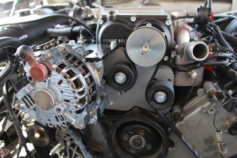 2003 Ford Crown Victoria - polished chrome alternator and idler pulleys mounted below a Kenne Bell supercharger bracket.