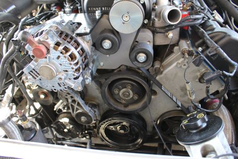 2003 Ford Crown Victoria - chrome alternator, crank pulley and tensioner pulleys arranged under a Kenne Bell supercharger.