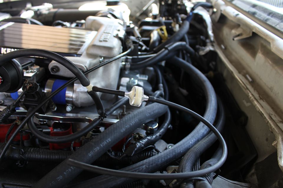 Engine bay with Kenne Bell supercharger and bundled hoses