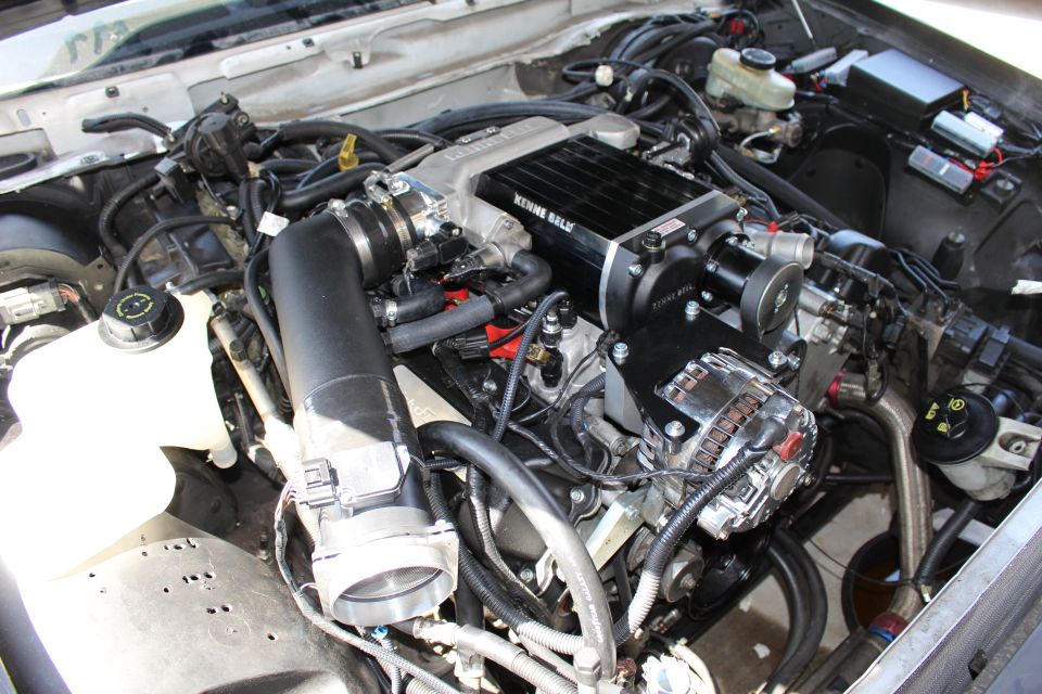Supercharged engine with Kenne Bell unit, alternator and intake tube