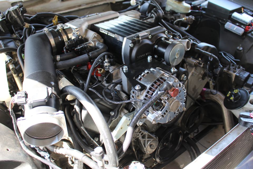 Kenne Bell supercharger over a chrome alternator in an engine bay