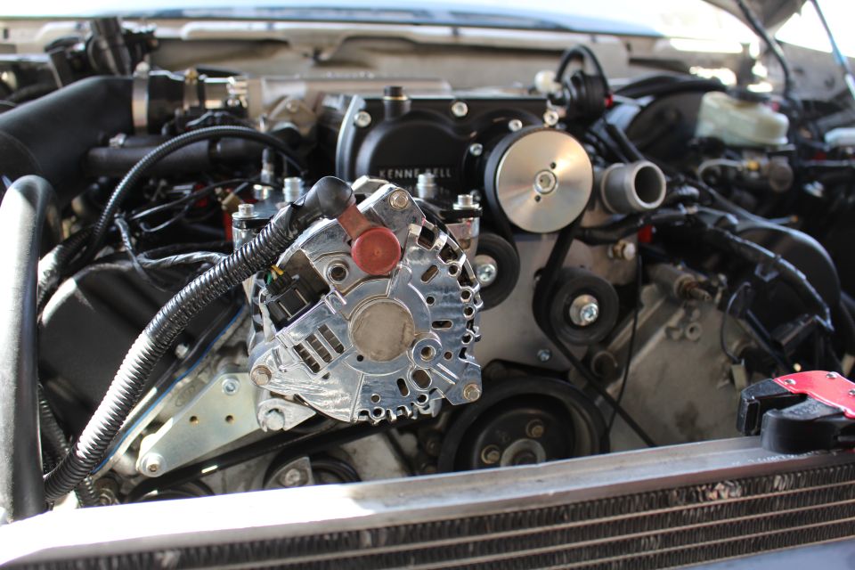Close view of polished alternator and Kenne Bell supercharger pulleys