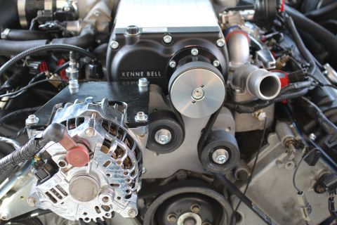 2003 Ford Crown Victoria - Detail of a black Kenne Bell supercharger mounted above a polished alternator and serpentine belt pulleys.