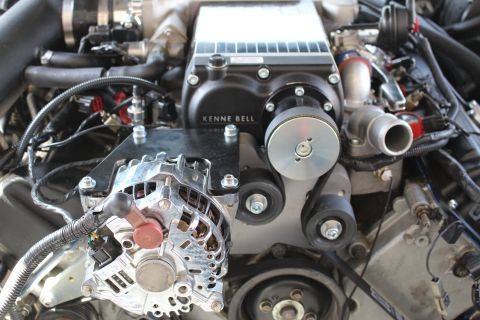 2003 Ford Crown Victoria - Engine compartment view of a Kenne Bell supercharger sitting atop the engine with a bright polished alternator below.