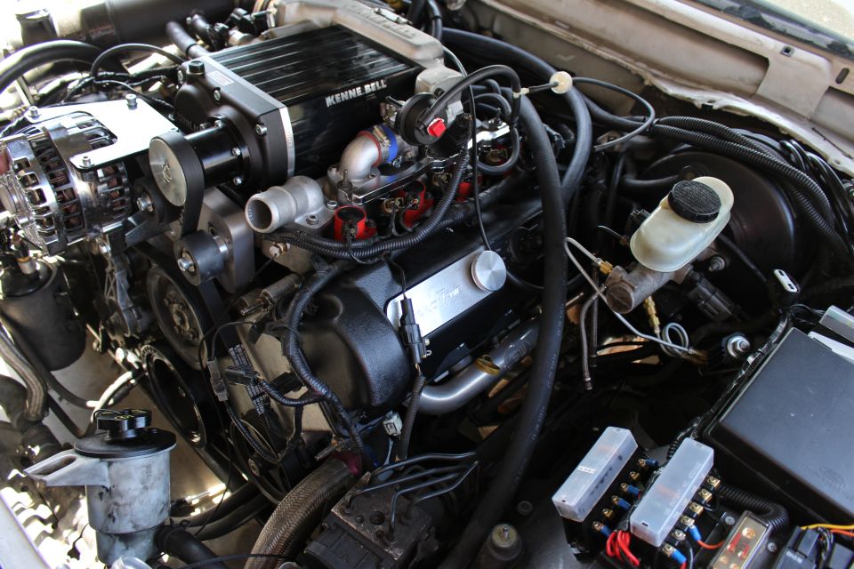 Engine bay with Kenne Bell supercharger and brake reservoir