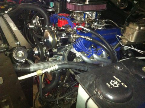 1982 Ford Bronco - Close-up view of a modified engine bay, showing various components and hoses.