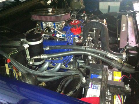 1982 Ford Bronco - Customized engine bay a blue engine block, chrome air filter, and various aftermarket components.