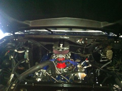 1982 Ford Bronco - Engine bay of a 1982 Ford Bronco, showing the V8 engine with custom chrome parts.