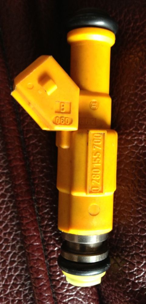 1989 Ford Bronco - This yellow Bosch fuel injector has the part number 0 280 155 700 stamped on its side.