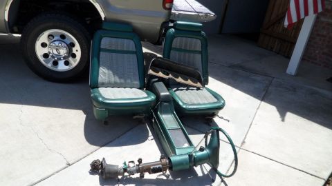 1972 Ford Ranchero - Interior parts including seats and steering column are laid out on the ground.