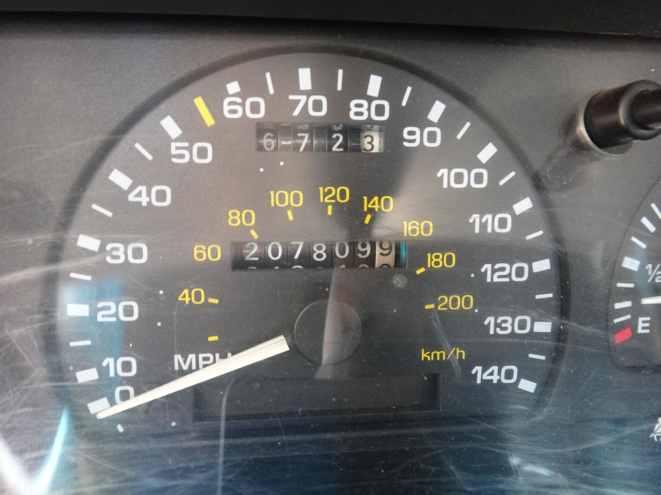 Speedometer reads 0, odometer shows 207809.9. Trip odometer reads 6-723