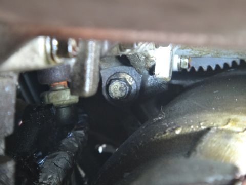1993 Ford Taurus - Detail of an engine component, possibly part of the transmission system, showing mechanical parts and fasteners.