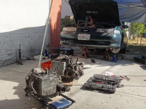 1993 Ford Taurus - 1993 Ford Taurus SHO undergoing maintenance with its transmission removed and laid out.