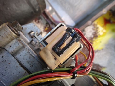 1993 Ford Taurus - Close-up view of an electrical connector and its associated wiring harness.