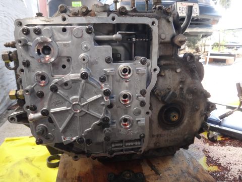 1993 Ford Taurus - Close-up of a Ford transmission valve body, showing internal components and fluid ports.