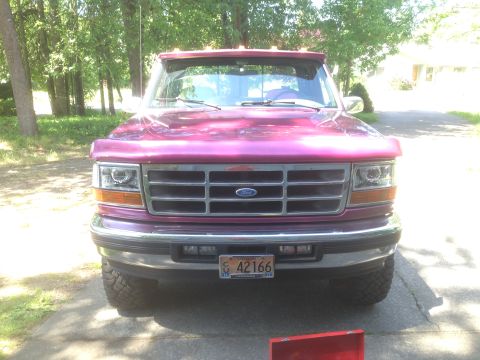 1992 Ford F-150 - This is a front-end shot of a Ford F-150 pickup truck, its distinctive grille and headlights.