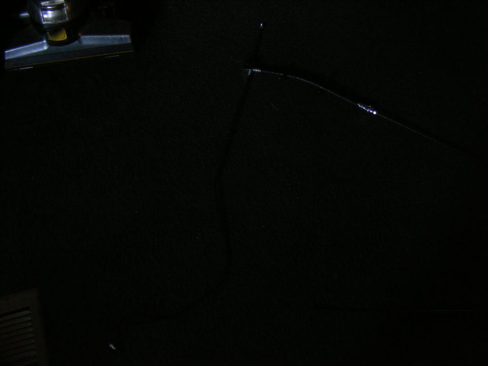 Black interior with a chrome and black interior light fixture on the upper left