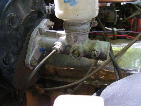 Brake master cylinder with reservoir and brake lines attached