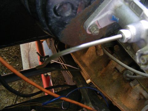 Close-up of a vehicle's brake master cylinder and associated lines