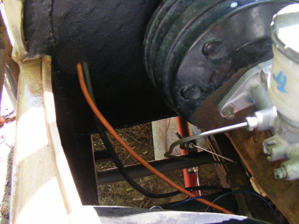 Brake booster and master cylinder assembly with orange and black wires