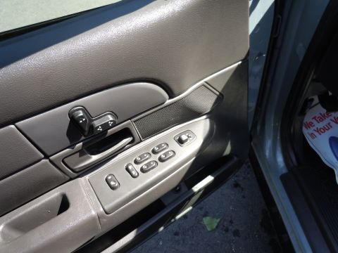 2001 Ford Crown Victoria - Interior view of a 2001 Ford Crown Victoria, focusing on the driver's side door controls.