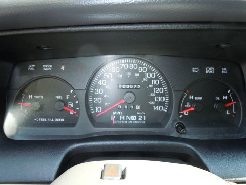 2001 Ford Crown Victoria - The dashboard of a car shows various gauges including speed, fuel, temperature, and oil levels, with an odometer reading of 50,572.