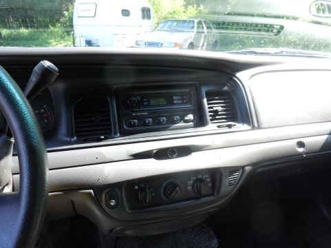 2001 Ford Crown Victoria - Interior view of a 2005 Ford Crown Victoria, with a trailer and another vehicle visible outside.
